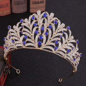 Macro detail of leaf-shaped rhinestone bridal crown with elegant blue crystals