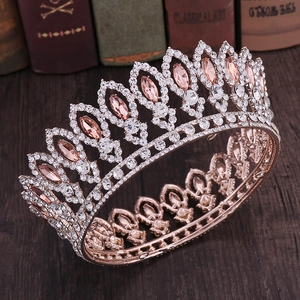 Close-up of rose gold bridal crown with champagne marquise gems on vintage books
