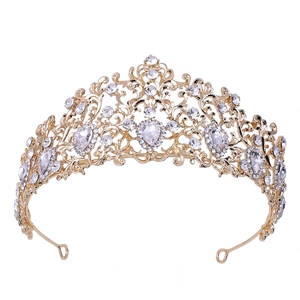 Elegant gold baroque bridal crown with leaf design and sparkling crystals on white background