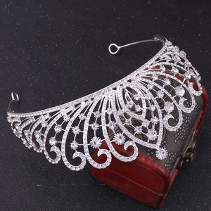 Close-up of silver luxury baroque tiara featuring intricate rhinestones and hollow design