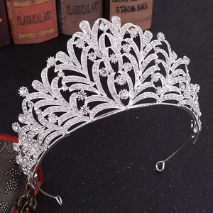 Macro detail of silver leaf crystal bridal tiara with intricate rhinestone pavé settings