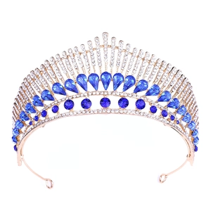 Golden peacock style wedding tiara with deep blue waterdrop crystals and rhinestones
