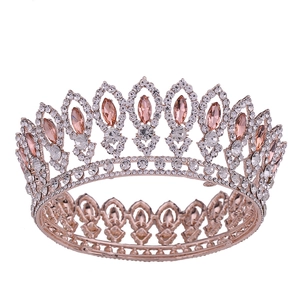 Baroque round bridal tiara in rose gold with pink marquise crystals and sparkling rhinestones