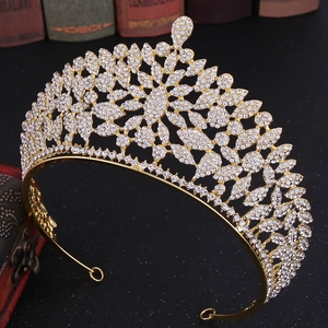 Macro detail of a luxurious gold floral crown set with sparkling white rhinestones