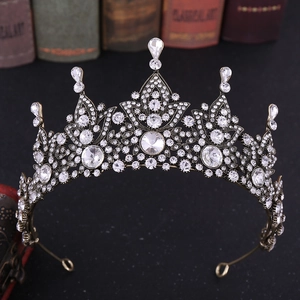 Macro shot of vintage bronze bridal crown featuring intricate crystal and teardrop rhinestones