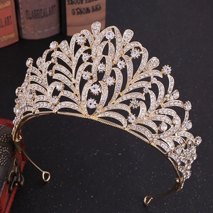 Macro detail of leaf bridal crown with sparkling rhinestones on golden metal base