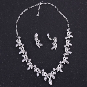 Close-up of bridal jewelry set with crystal marquise-cut necklace and clip-on earrings