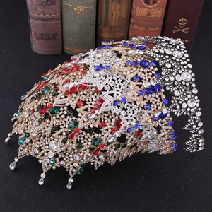 Detailed close-up of Baroque bridal crowns with colorful gemstones and intricate hollow carvings