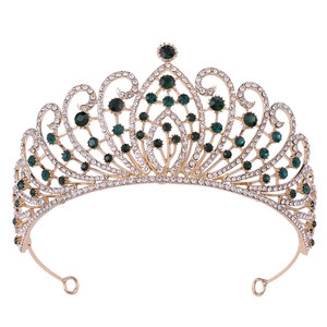 Detail view of Baroque bridal crown with emerald green stones and sparkling rhinestones