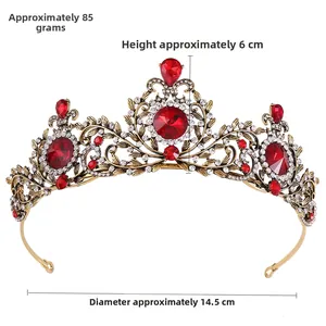 Detailed view of baroque crown with red jewels and measurements of 6cm height and 14.5cm width