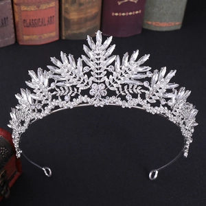 Close-up of silver crystal bridal crown featuring marquise and round cut rhinestones