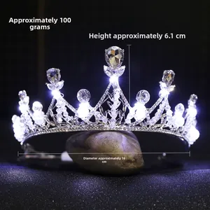 Detail of silver alloy bridal crown with waterdrop crystals and glowing LED lights