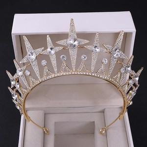 Macro detail of gold bridal crown with sparkling stars and crystal rhinestones