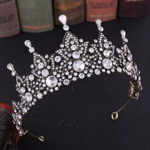 Detailed macro view of baroque crown with crystals on vintage bronze alloy base
