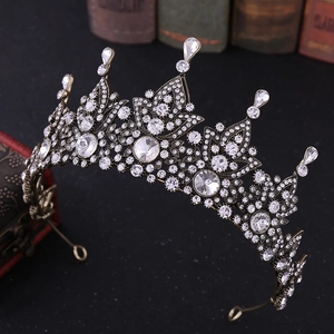Macro side view of vintage Baroque bridal crown with bronze finish and clear crystals