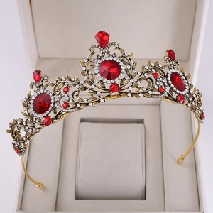 Baroque vintage gold crown with red teardrop gemstones in a premium jewelry gift box