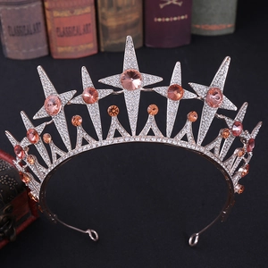 Close-up of starry bridal tiara with champagne gemstones and pavé crystals on a vintage book