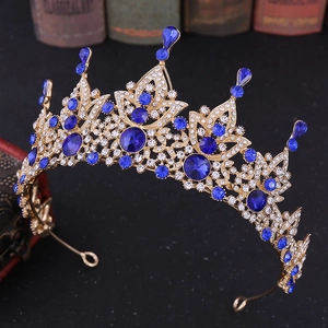 Macro shot of Baroque bridal crown with blue crystals and vintage props background