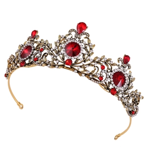 Baroque vintage gold crown for brides with large red gemstones and intricate leaf details