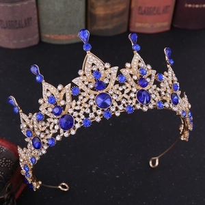Detailed view of Baroque bridal crown with blue crystals and vintage gold alloy frame