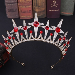 Detailed macro view of vintage gold star crown featuring red crystals and white rhinestones