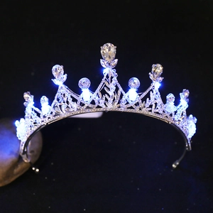 Macro view of crystal beaded crown with glowing LED lights for wedding bridal headwear