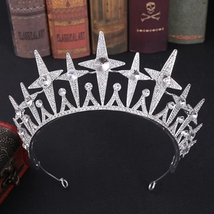 Macro detail of silver star bridal tiara with sparkling rhinestones and moon accents