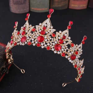 Baroque golden bridal crown with red crystals and white rhinestones on vintage books