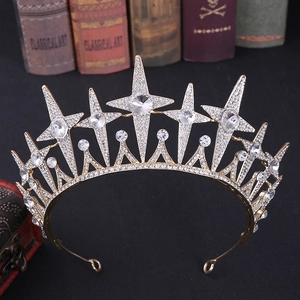 Detailed close-up of golden bridal crown with sparkling stars and clear rhinestones