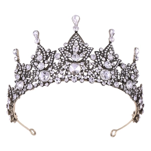 Baroque vintage bronze bridal crown with sparkling crystal rhinestones on white background