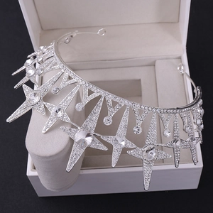Detailed macro shot of silver bridal crown featuring sparkling rhinestone star elements