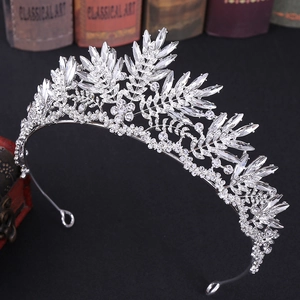 Elegant bridal crown with silver sparkling crystals and intricate leaf design for weddings