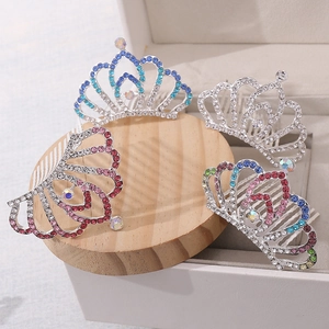 Detailed view of silver alloy crown hair combs with sparkling colorful rhinestones