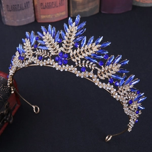 Detailed macro view of gold crystal bridal crown featuring royal blue marquise gemstones