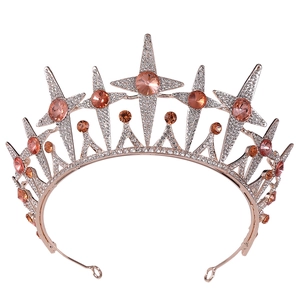 Detailed close-up of rose gold star tiara with champagne stones and sparkling crystals