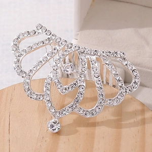 Detailed macro view of silver rhinestone tiara hair comb for girl pageant gifts
