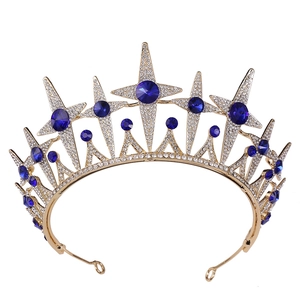 Elegant gold bridal crown featuring navy blue stones and star-shaped crystal rhinestones