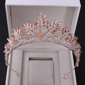 Luxurious rose gold crystal bridal crown with leaf patterns and champagne stones