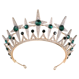 Detailed view of luxury bridal crown featuring green gemstones and star rhinestone patterns