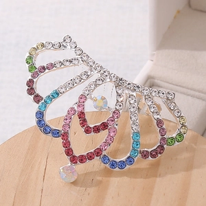 Detail of colorful rhinestone children tiara hair comb with vibrant gradient crystals