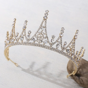 Elegant gold baroque bridal crown featuring sparkling crystal rhinestones for wedding decor