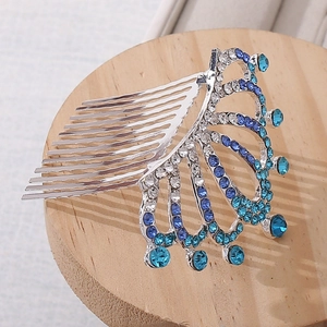 Detailed view of princess crown hair comb with blue gradient rhinestones and silver alloy base