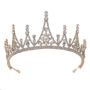 Elegant gold baroque bridal crown with snowflake pattern and sparkling rhinestones
