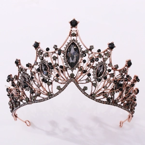 Detail of baroque gothic crown featuring dark grey gemstones and rose gold filigree