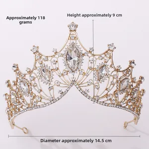 Detailed view of golden baroque crown with clear crystals, 9cm high and 14.5cm wide