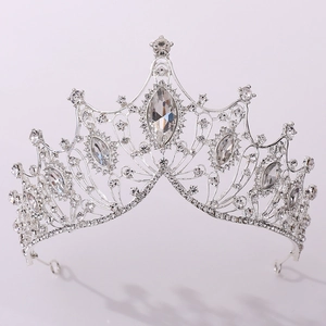 Close-up of silver bridal crown featuring marquise crystals and intricate vine patterns