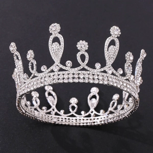 Detail shot of the glittering silver tiara with intricate floral rhinestone patterns