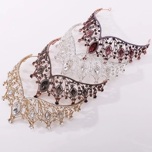 Macro shot of four color variations of baroque bridal crowns with crystal inlay