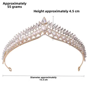 Detailed view of bridal crown with white pearls and crystals on a gold alloy frame