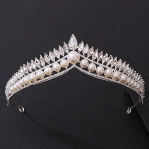 Elegant bridal tiara with pearls and sparkling crystals on silver metal base